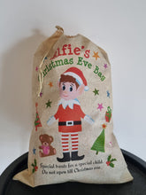Load image into Gallery viewer, Christmas-themed bag with a child's face and text on a white background