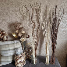 Load image into Gallery viewer, Decorative items including spiral twigs, vase with branches, and decorative pot pourri on a table against a patterned wall.