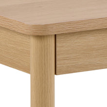 Load image into Gallery viewer, Close-up of a light oak wood table showing the tabletop, drawer front, and leg with visible wood grain texture on a white background.