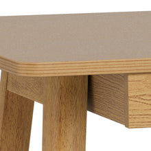 Load image into Gallery viewer, Wooden table with a beige cushioned top on a white background
