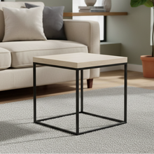 Load image into Gallery viewer, A square coffee table with a travertine stone effect top and a black metal base.