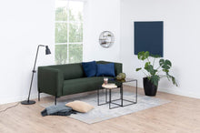 Load image into Gallery viewer, Modern living room with a green sofa, coffee table, and decorative items.
