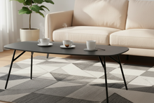 Load image into Gallery viewer, Coffee table with cups on a patterned rug in a living room
