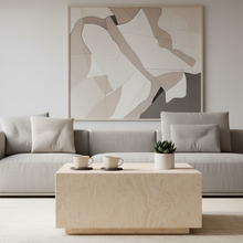 Load image into Gallery viewer, Modern living room with a gray sofa, abstract painting, and decorative items.