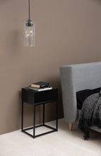 Load image into Gallery viewer, Modern bedroom with a black side table, gray bed, and pendant light.