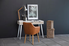 Load image into Gallery viewer, A modern home office setup featuring a white desk with white legs, a brown leather chair, a wooden desk lamp, and a framed botanical print against a dark gray wall.