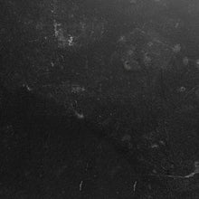 Load image into Gallery viewer, Close-up of a textured black surface