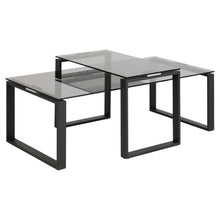 Load image into Gallery viewer, A set of 2 Katrine coffee tables, featuring smoked glass tops and matte black metal bases.