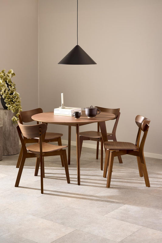 Roxby walnut dining chairs arranged around a round dining table in a warm neutral dining room