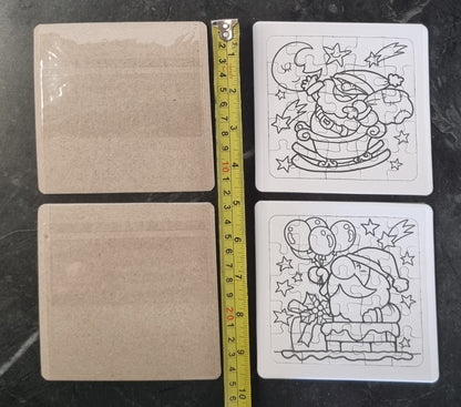Two square jigsaw puzzle pieces shown on a dark marble-like surface, alongside two plain beige backing cards and a yellow tape measure for scale. The right-side puzzle pieces have black line-art illustrations of a turtle and a moon/cactus scene.