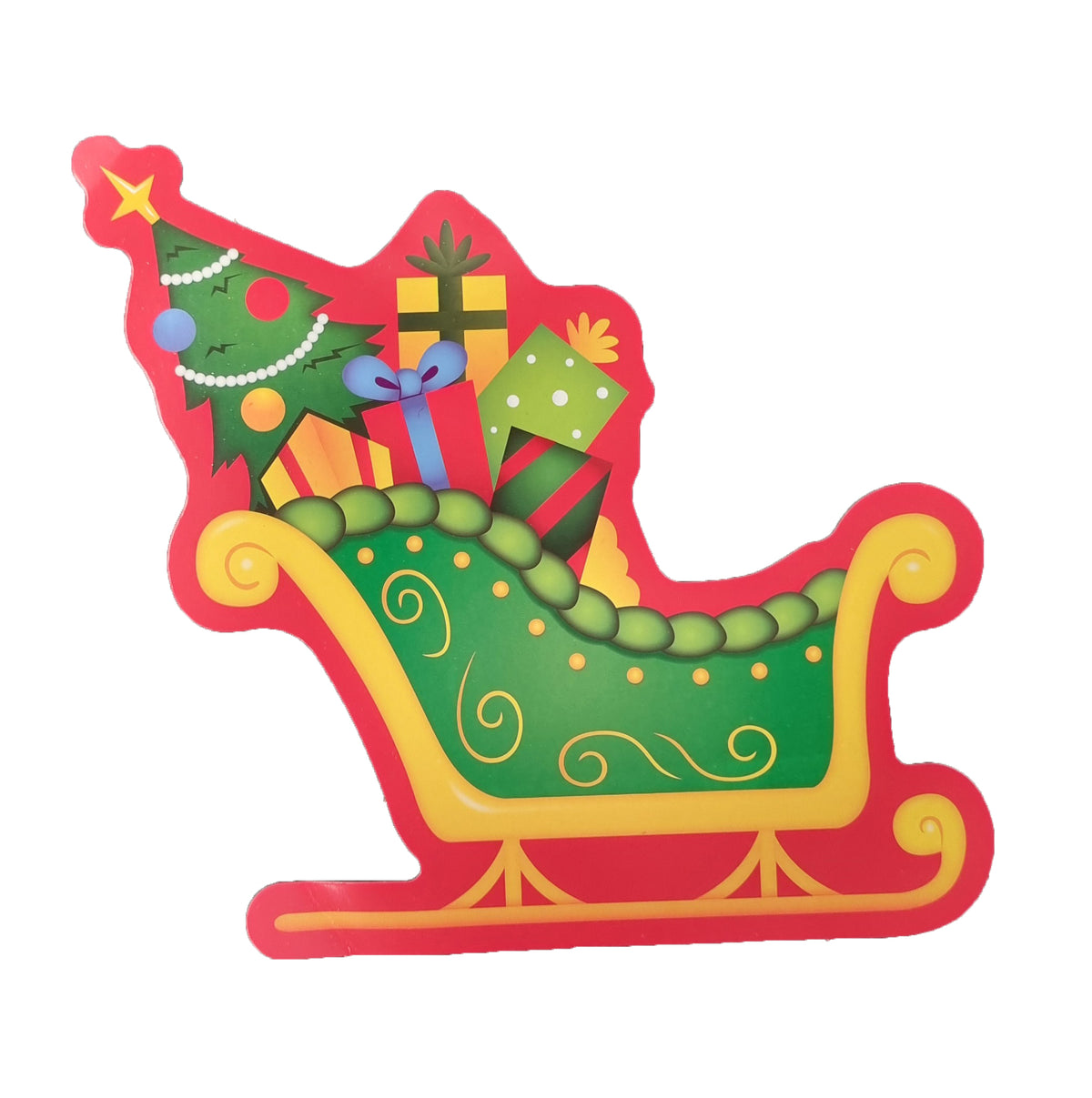 A festive Christmas-themed decorative sign or plaque shaped like a sleigh carrying a decorated Christmas tree, wrapped gifts, and presents. The sleigh is outlined in red with gold trim, and the interior features green, yellow, blue, and orange holiday details, all on a plain white background.