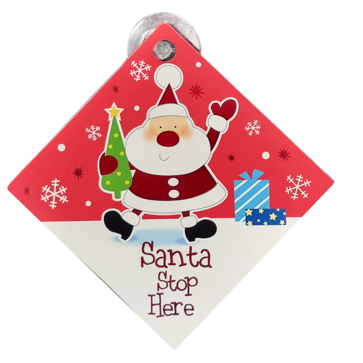 A diamond-shaped Christmas sign featuring a cartoon Santa Claus walking past a green Christmas tree and blue gift boxes, with the words 'Santa Stop Here' printed at the bottom. The sign has a red top half with white snowflakes, a white bottom half, and a silver metal hanger at the top.