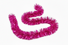 Load image into Gallery viewer, A bright pink metallic tinsel garland, coiled in a spiral shape on a plain white background.
