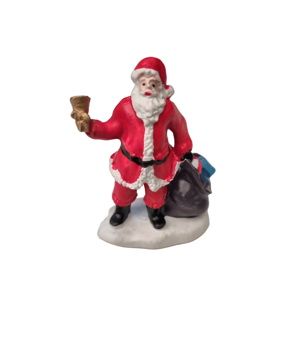 A vintage-style Santa Claus figurine standing on a snowy base, holding a gold bell in one hand and carrying a dark sack over his shoulder. The Santa suit is primarily red with white trim, and the figurine is photographed against a plain white background.