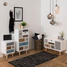 Load image into Gallery viewer, A styled interior scene showing three white storage cabinets with mixed wood and muted blue drawer fronts, placed on a wood floor against a white wall. The room includes pendant lights, framed wall art, a black scarf, a basket, pillows, and a black-and-white rug.
