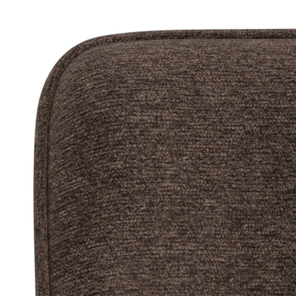 Close-up of a textured brown surface of an Adia dining chair