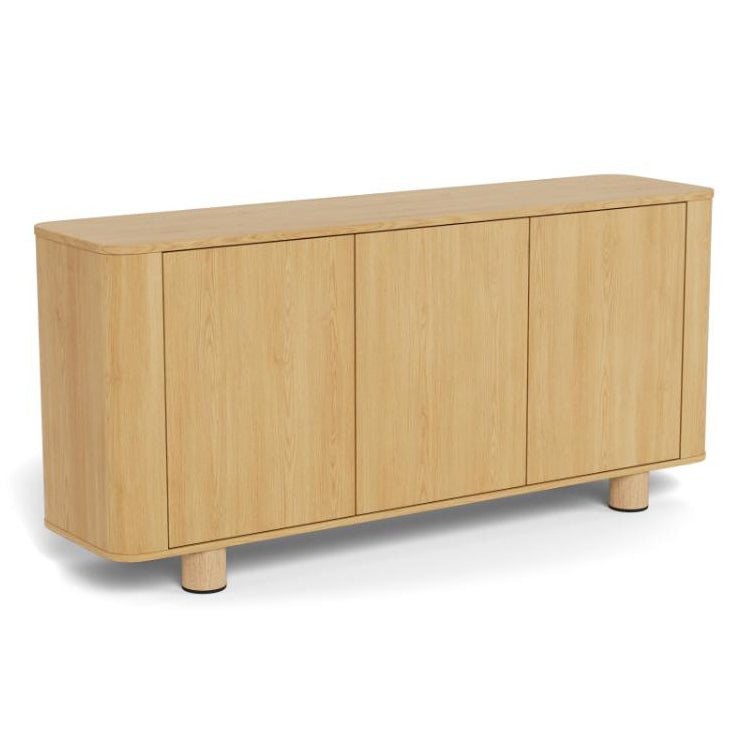 A light oak wood Atmore sideboard cabinet with three front doors, rounded edges, and short cylindrical legs, shown on a plain white background.