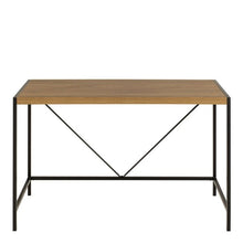 Load image into Gallery viewer, A rectangular writing desk with a light brown wood grain top and a black metal frame featuring a geometric V-shaped support under the tabletop.
