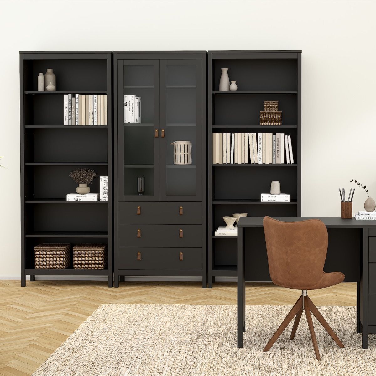 Barcelona black bookcases beside a glazed display cabinet in a styled home office
