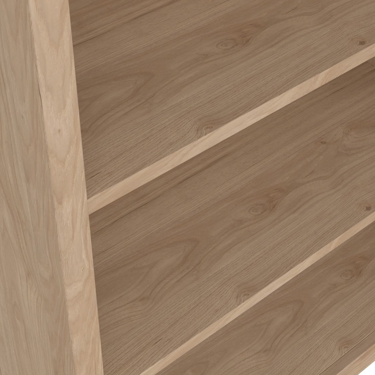 Close up view of an oak bookcase showing the grain of the wooden shelves