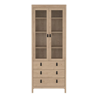 A tall light oak wood cabinet with two upper glass doors and five lower drawers, shown against a plain white background.