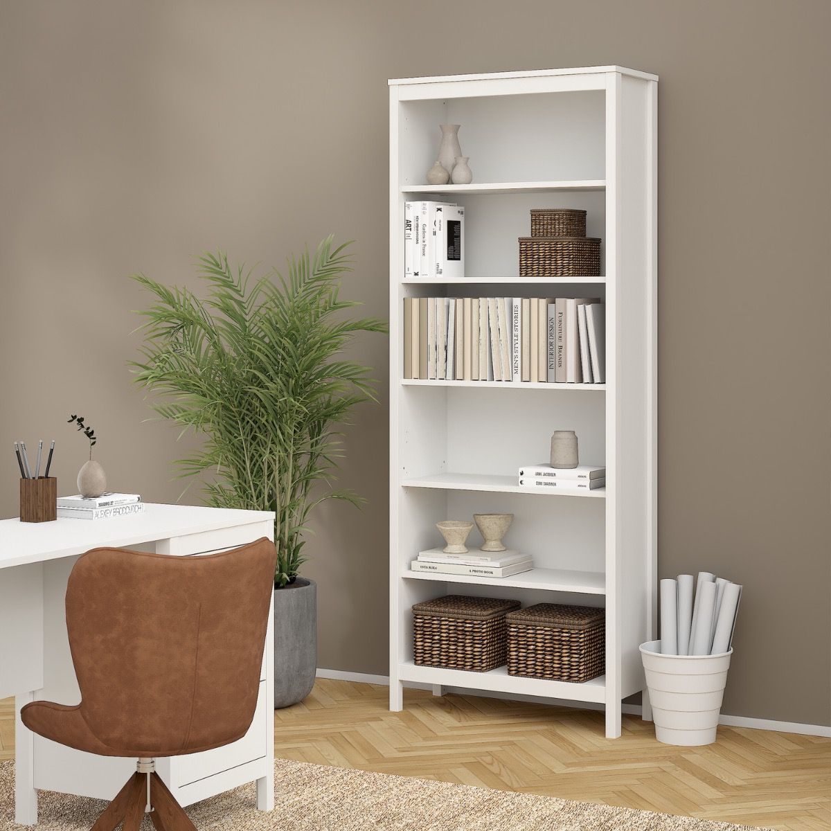 A tall white Barcelona 5-shelf bookcase stands in a styled home office setting next to a desk, chair, and potted plant, holding books, baskets, and decorative vases.