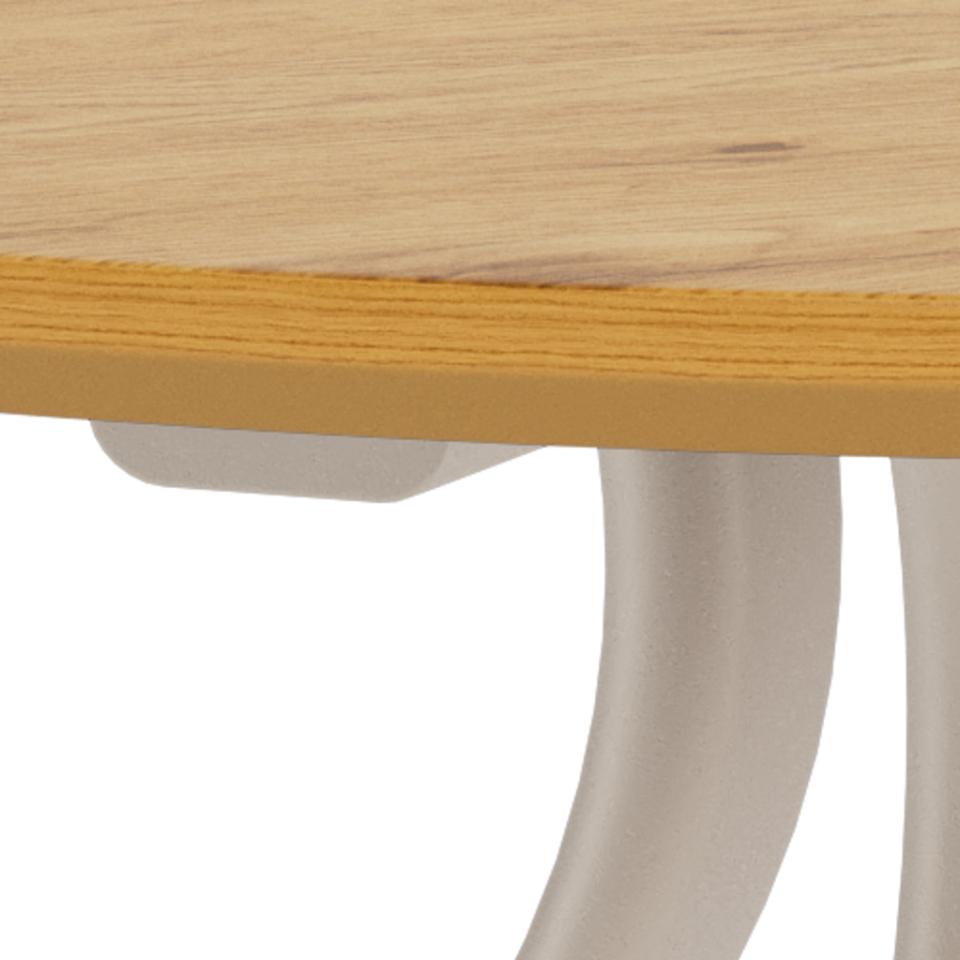 Close-up detail of a table showing a light natural wood top edge with a yellow-orange wood veneer or laminate strip along the front, supported by a curved off-white metal leg on a white background.