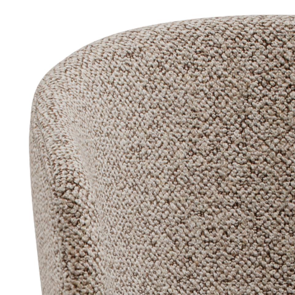 Close-up of a textured beige bar stool seat surface