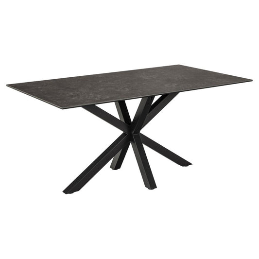 A rectangular black ceramic dining table with a solid metal base featuring a cross design.
