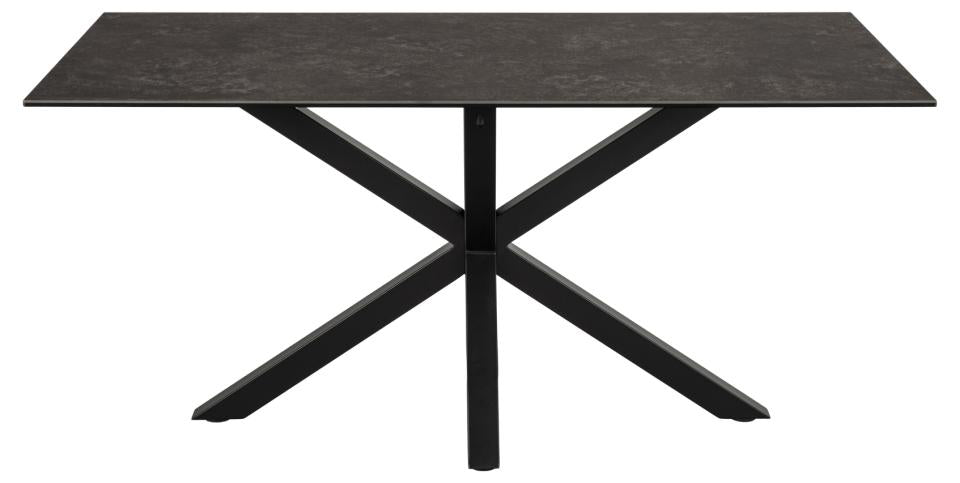 A modern rectangular dining table with a dark textured black top and a black metal X-shaped pedestal base, shown against a plain white background.
