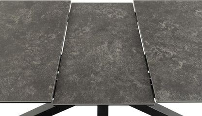 extending ceramic dining table close up with a neutral background
