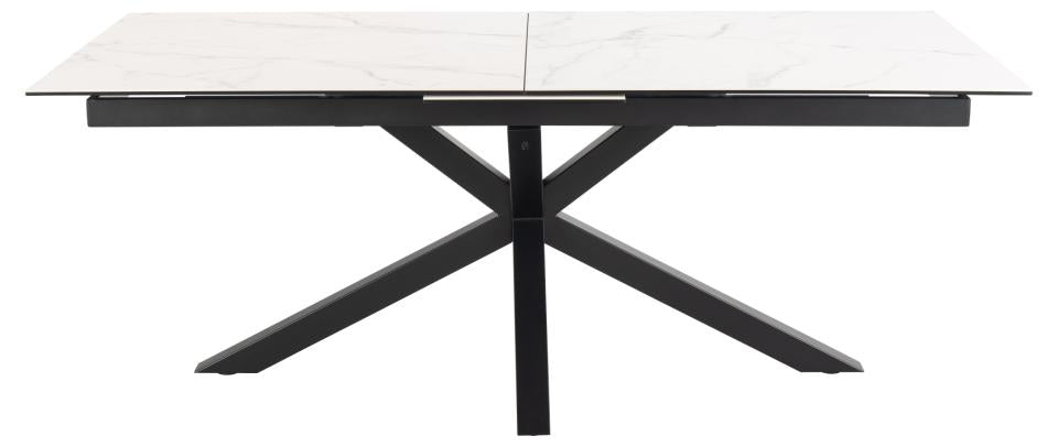 A modern rectangular dining table with a white marble-patterned top and a black metal X-shaped base, shown on a plain white background.