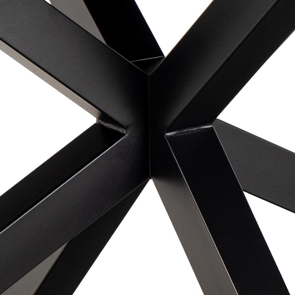 Close-up of a black metal frame with intersecting beams on a white background