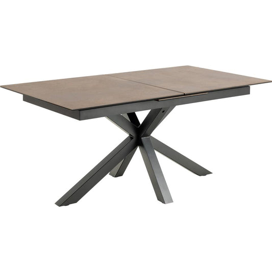 A rectangular extendable dining table with a rustic brown ceramic top and a cross base with black ceramic legs.
