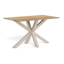 Load image into Gallery viewer, A rectangular dining table with a light oak wood grain top and a modern light beige X-shaped metal base, shown on a solid white background.
