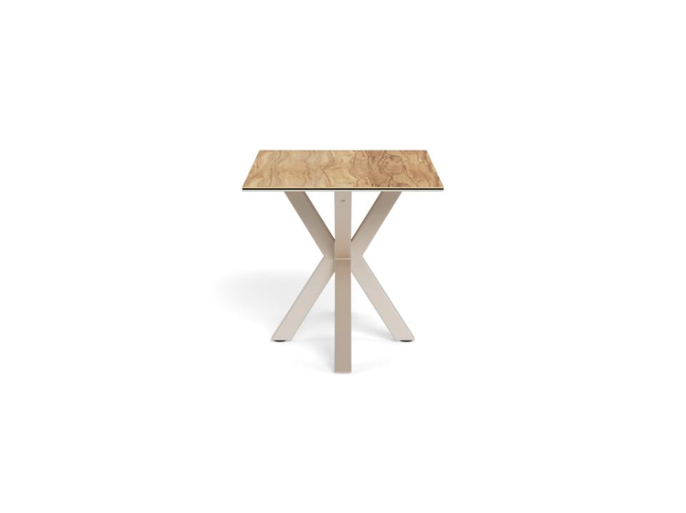 Square table with a wooden top and metal legs on a white background