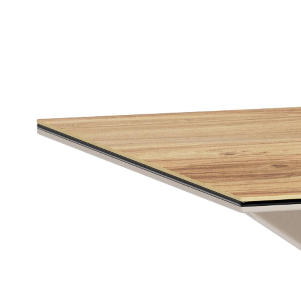 Close-up of a rectangular tabletop corner showing a light natural wood grain top with a thin black edge and a white base, photographed on a white background.