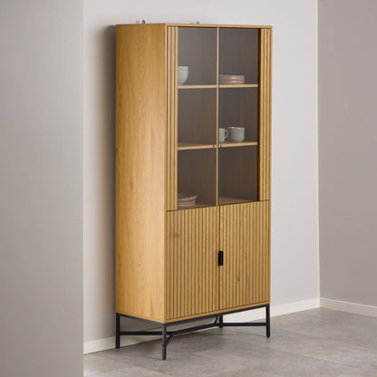 Wooden Jaipur cabinet with glass doors against a plain wall
