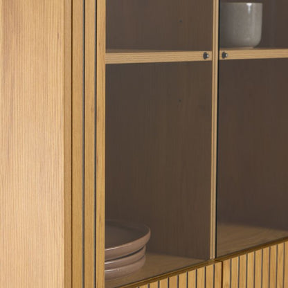 Wooden cabinet with glass doors displaying ceramic bowls.