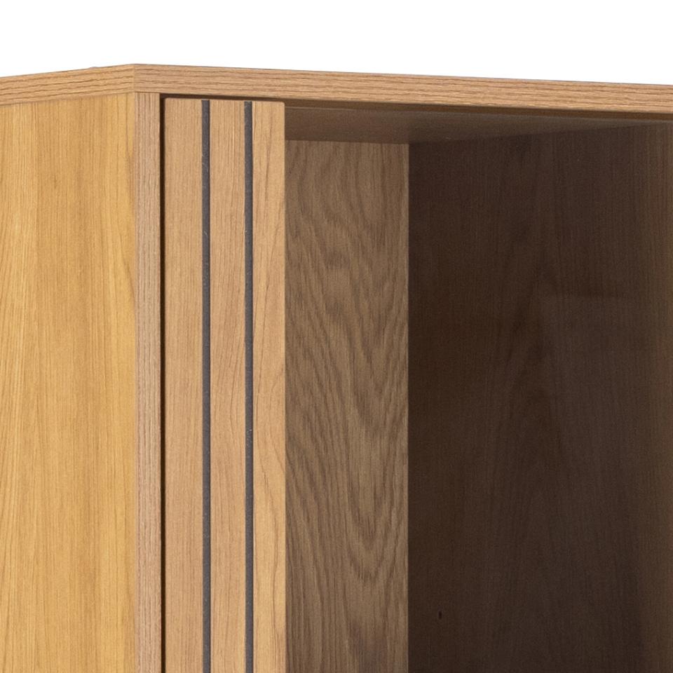 Close-up of a wooden cabinet with a light oak exterior door featuring lamella wood strip front and a darker brown wood interior.