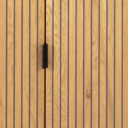 Close-up of a wooden cabinet door with vertical woodgrain panels and a single black rectangular handle centered between the doors.