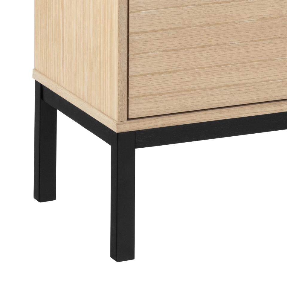 Bottom of a wooden sideboard with black legs on a white background