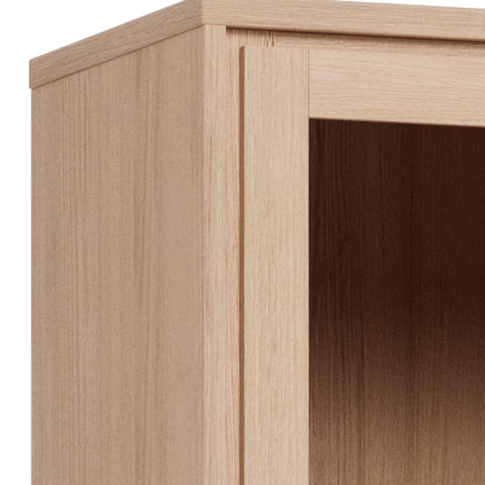 Close-up of a light natural wood cabinet corner showing the outer frame, inner panel, and shelf opening with visible wood grain texture.