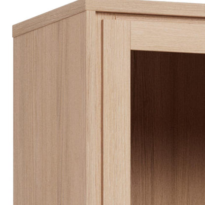 Close-up of a light natural wood cabinet corner showing the outer frame, inner panel, and shelf opening with visible wood grain texture.