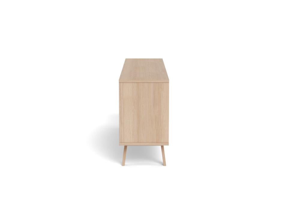 A light natural wood sideboard or cabinet with tapered legs, shown from a direct side angle on a solid white background.