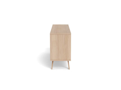 A light natural wood sideboard or cabinet with tapered legs, shown from a direct side angle on a solid white background.