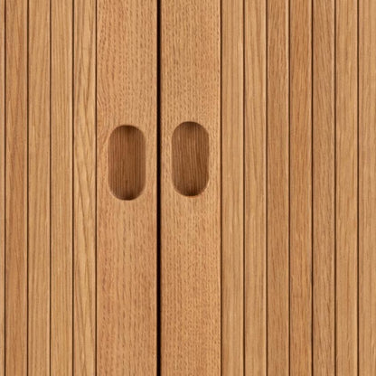 Close-up of wooden panel with two oval cutouts