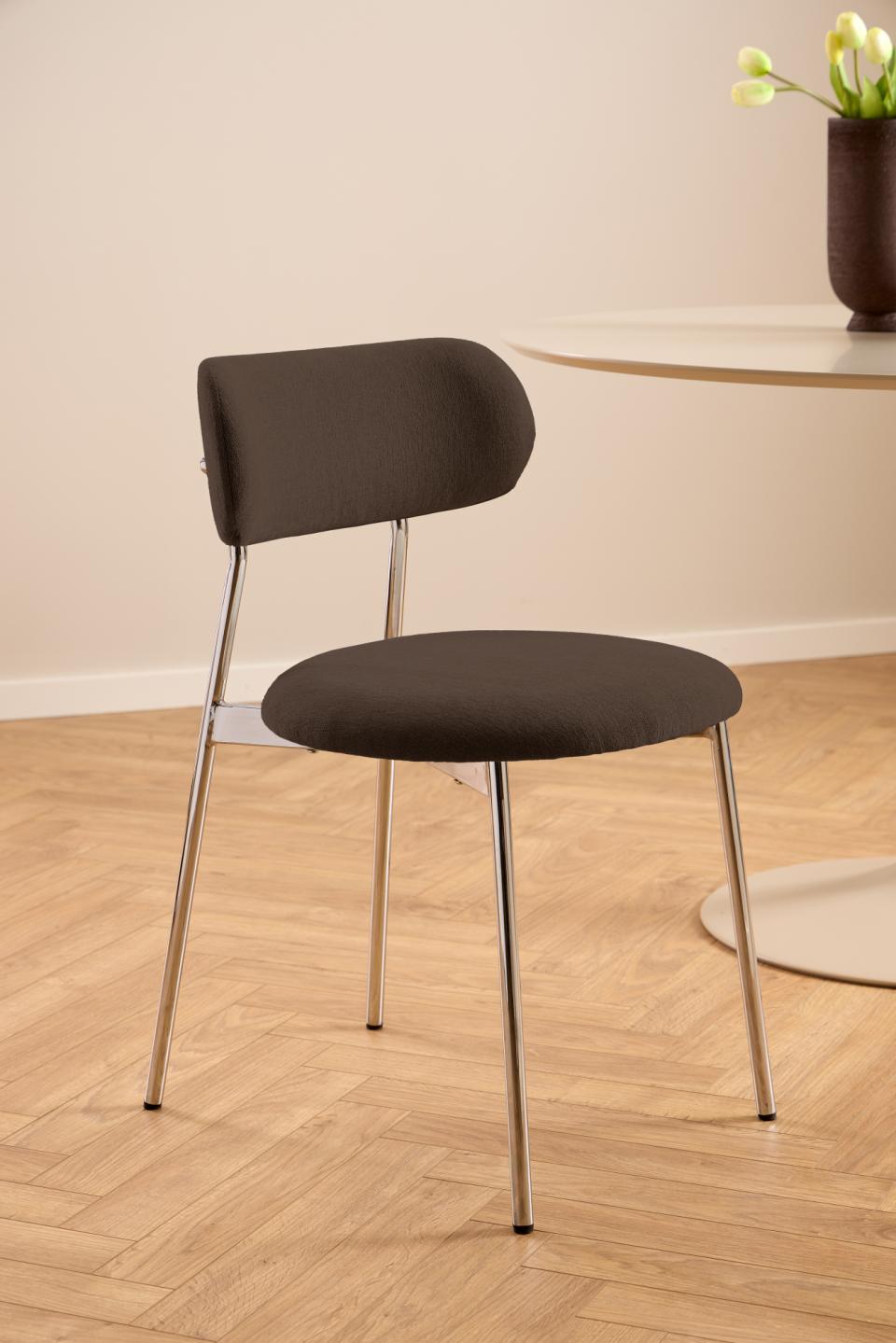 Brown chair with metal legs on a wooden floor