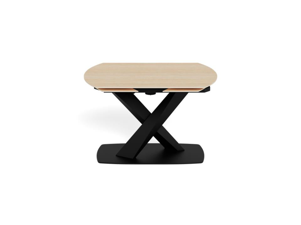 Morella extendable dining table with black metal base on a white background
