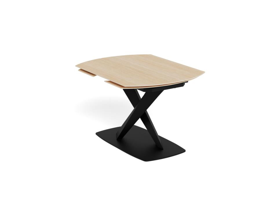 Modern dining table with ceramic top and black metal base on a white background
